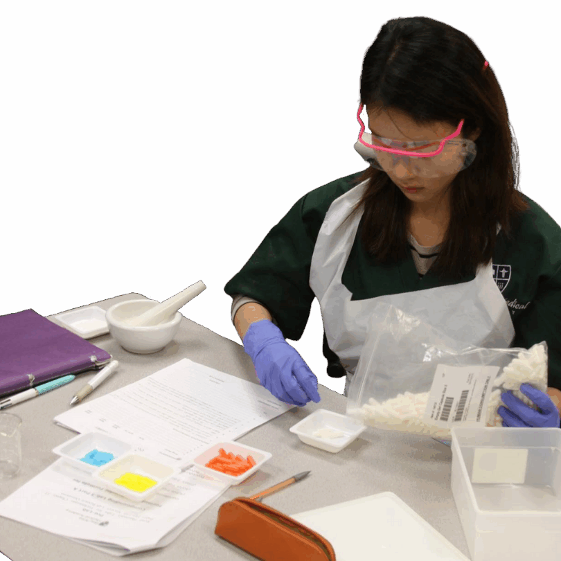 medical assistant students packaging medicine