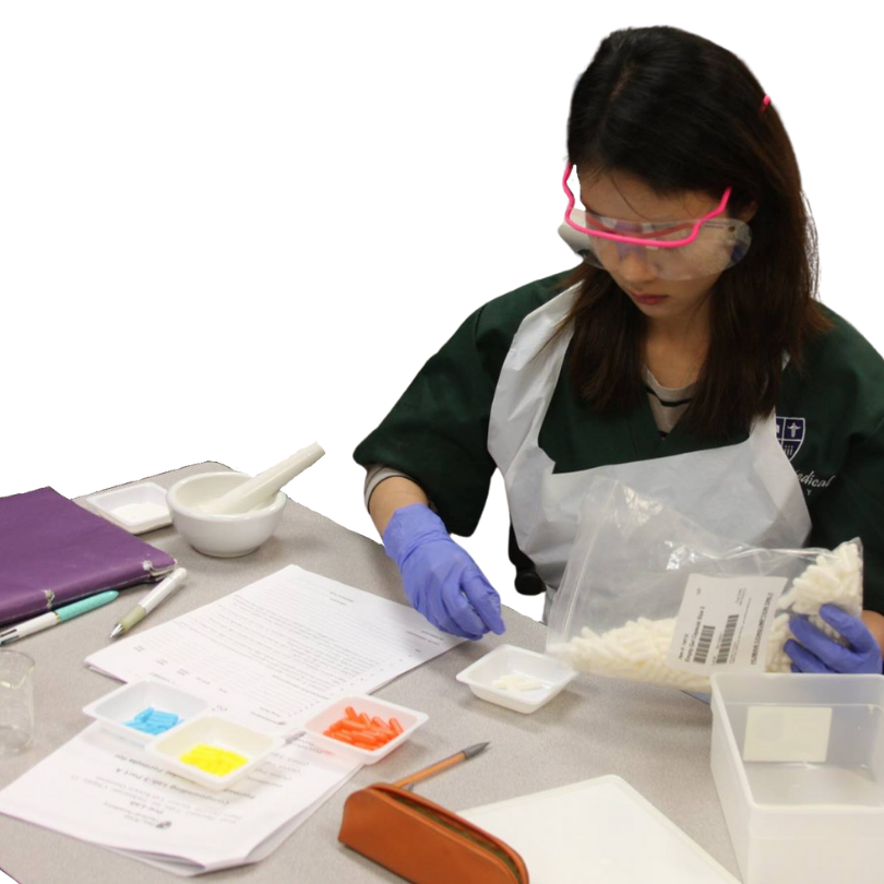 medical assistant students packaging medicine