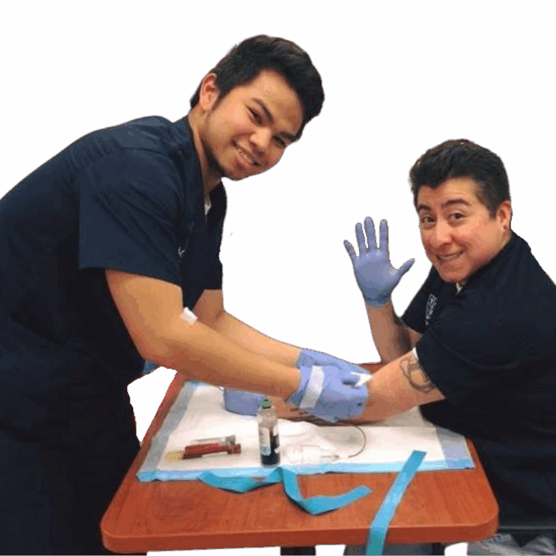 two medical assistant students practicing blood draws